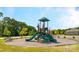 Vibrant community playground featuring slides, climbing structures, and a cushioned play area for outdoor fun at 133 Calvin Creek Dr, Troutman, NC 28166