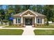 Charming pool house with stone accents and gated entry, enhancing the community's recreational amenities at 133 Calvin Creek Dr, Troutman, NC 28166