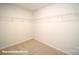 Spacious walk-in closet with ample shelving, providing optimal storage solutions for an organized wardrobe at 133 Calvin Creek Dr, Troutman, NC 28166