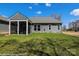 Back of the house features a screened-in porch and ample green space at 2011 Mantle Ridge Dr # 193, Wesley Chapel, NC 28079