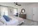 Bedroom featuring white shiplap walls, plush carpeting, and neutral-toned decor at 2011 Mantle Ridge Dr # 193, Wesley Chapel, NC 28079