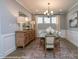 Dining room featuring modern chandelier and decorative sideboard at 2011 Mantle Ridge Dr # 193, Wesley Chapel, NC 28079