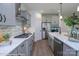 Modern kitchen featuring stainless steel appliances, gray cabinets, white countertops and tile backsplash at 2011 Mantle Ridge Dr # 193, Wesley Chapel, NC 28079