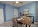 Bright, carpeted home office featuring a ceiling fan, desk, and a window for natural light at 2011 Mantle Ridge Dr # 193, Wesley Chapel, NC 28079