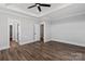 A spacious bedroom featuring modern ceiling fan, trim, and wood-look flooring at 2063 Fordhill St, Rock Hill, SC 29732