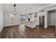 Open-concept kitchen featuring white cabinets, a center island, stainless steel appliances, and modern light fixtures at 2063 Fordhill St, Rock Hill, SC 29732