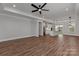 Bright open-concept living space with hardwood floors and white accents looking into the kitchen at 2078 Fordhill St, Rock Hill, SC 29732