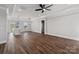 Open-concept living area with hardwood floors leading into kitchen with modern lighting fixtures at 2078 Fordhill St, Rock Hill, SC 29732