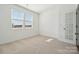 Bright bedroom with neutral carpet and large windows filling the room with light at 2581 Blue Sky Meadows Dr, Monroe, NC 28110