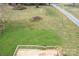 An elevated view showcasing the expansive green backyard with an outdoor wooden deck at 3001 Austin Chaney Rd, Monroe, NC 28110