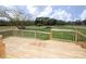 Wooden deck overlooks the spacious backyard with its lush greenery at 3001 Austin Chaney Rd, Monroe, NC 28110