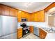 Updated kitchen with stainless steel appliances, bright cabinets, white countertops, and subway tile backsplash at 3001 Austin Chaney Rd, Monroe, NC 28110