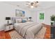 Serene bedroom with stylish bed, modern nightstands, and ample natural light from the window at 5114 Glenbrier Dr, Charlotte, NC 28212