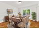 Elegant dining room with hardwood floors, large windows and stylish decor at 5114 Glenbrier Dr, Charlotte, NC 28212