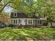 Charming home with green lawn, mature trees, and two-car garage at 5114 Glenbrier Dr, Charlotte, NC 28212