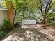 Two-car garage is painted neutral green, has two doors, and a concrete driveway at 5114 Glenbrier Dr, Charlotte, NC 28212
