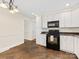 Functional kitchen with white cabinets, and modern appliances at 5114 Glenbrier Dr, Charlotte, NC 28212