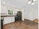 Clean kitchen with white cabinetry, modern appliances, and ample counter space at 5114 Glenbrier Dr, Charlotte, NC 28212