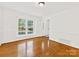 Bright and airy living room with hardwood floors, large windows at 5114 Glenbrier Dr, Charlotte, NC 28212