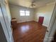 Bedroom with hardwood floors, a ceiling fan, and a window for natural light at 5226 Indian Trail Fairview Rd, Indian Trail, NC 28079