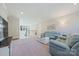 Relaxing basement living area with comfortable sofas, neutral decor, and plenty of space for entertaining at 6398 Chimney Bluff Rd, Lancaster, SC 29720