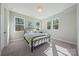 Cozy bedroom with large windows and a comfortable bed, perfect for relaxing after a long day at 6398 Chimney Bluff Rd, Lancaster, SC 29720