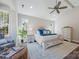 Well-lit bedroom with neutral tones, ceiling fan, and a comfortable bed with blue accent pillows at 6398 Chimney Bluff Rd, Lancaster, SC 29720