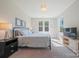 Well-lit bedroom with cozy decor, comfortable bed, and ample natural light, creating a relaxing atmosphere at 6398 Chimney Bluff Rd, Lancaster, SC 29720