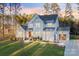 Charming two-story home with a well-manicured lawn, inviting entrance, and attached garage at 6398 Chimney Bluff Rd, Lancaster, SC 29720