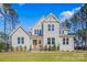 Charming two-story home with a welcoming front porch, well-manicured lawn, and classic white siding at 6398 Chimney Bluff Rd, Lancaster, SC 29720