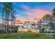 Stunning two-story home with beautiful landscaping, large windows, and a well-maintained lawn at 6398 Chimney Bluff Rd, Lancaster, SC 29720