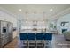 Spacious kitchen featuring a large island with seating, stainless steel appliances, and ample counter space at 6398 Chimney Bluff Rd, Lancaster, SC 29720
