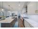 Gourmet kitchen featuring white cabinets, stainless steel appliances, and a large island at 6398 Chimney Bluff Rd, Lancaster, SC 29720