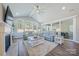 Spacious living room with vaulted ceiling, fireplace, hardwood floors, and sliding glass doors at 6398 Chimney Bluff Rd, Lancaster, SC 29720