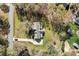 Aerial view of home with a long driveway, mature trees, and a spacious backyard at 7146 Sifford Rd, Stanley, NC 28164