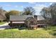 Spacious backyard with a deck and a covered porch at 7146 Sifford Rd, Stanley, NC 28164