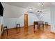 Bonus room featuring hardwood floors, ceiling fan, and foosball table at 7146 Sifford Rd, Stanley, NC 28164