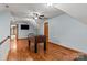 Spacious bonus room with hardwood floors, ceiling fan, and foosball table at 7146 Sifford Rd, Stanley, NC 28164