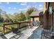 Outdoor deck space featuring seating, a grill, and a patterned rug at 7146 Sifford Rd, Stanley, NC 28164