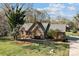 Beautiful brick home with mature trees and well-manicured lawn at 7146 Sifford Rd, Stanley, NC 28164