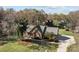 Brick home featuring mature landscaping, an American flag, and a spacious driveway at 7146 Sifford Rd, Stanley, NC 28164