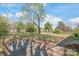 Large backyard with a tree providing shade and a small patio area, perfect for outdoor activities at 7207 Idlewild Rd, Charlotte, NC 28212