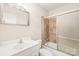 Well-lit bathroom featuring a shower with sliding glass doors at 7207 Idlewild Rd, Charlotte, NC 28212
