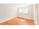 Comfortable bedroom with hardwood floors and bright window at 7207 Idlewild Rd, Charlotte, NC 28212