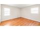 Cozy bedroom with hardwood floors and natural light at 7207 Idlewild Rd, Charlotte, NC 28212