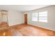 Inviting living room with hardwood floors and a front door entrance at 7207 Idlewild Rd, Charlotte, NC 28212