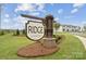 Community sign for 'Ridge at Sugar Creek' with manicured landscaping and sidewalk at 8654 Miles Gap Rd, Indian Land, SC 29707