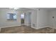 Open living area with modern lighting and access to kitchen at 11011 Park Rd, Charlotte, NC 28226