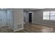 Spacious living room with updated flooring and view of staircase at 11011 Park Rd, Charlotte, NC 28226