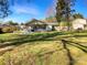 Exterior shot featuring a spacious, grassy backyard and screened in patio at 11712 Battery Pl, Charlotte, NC 28273